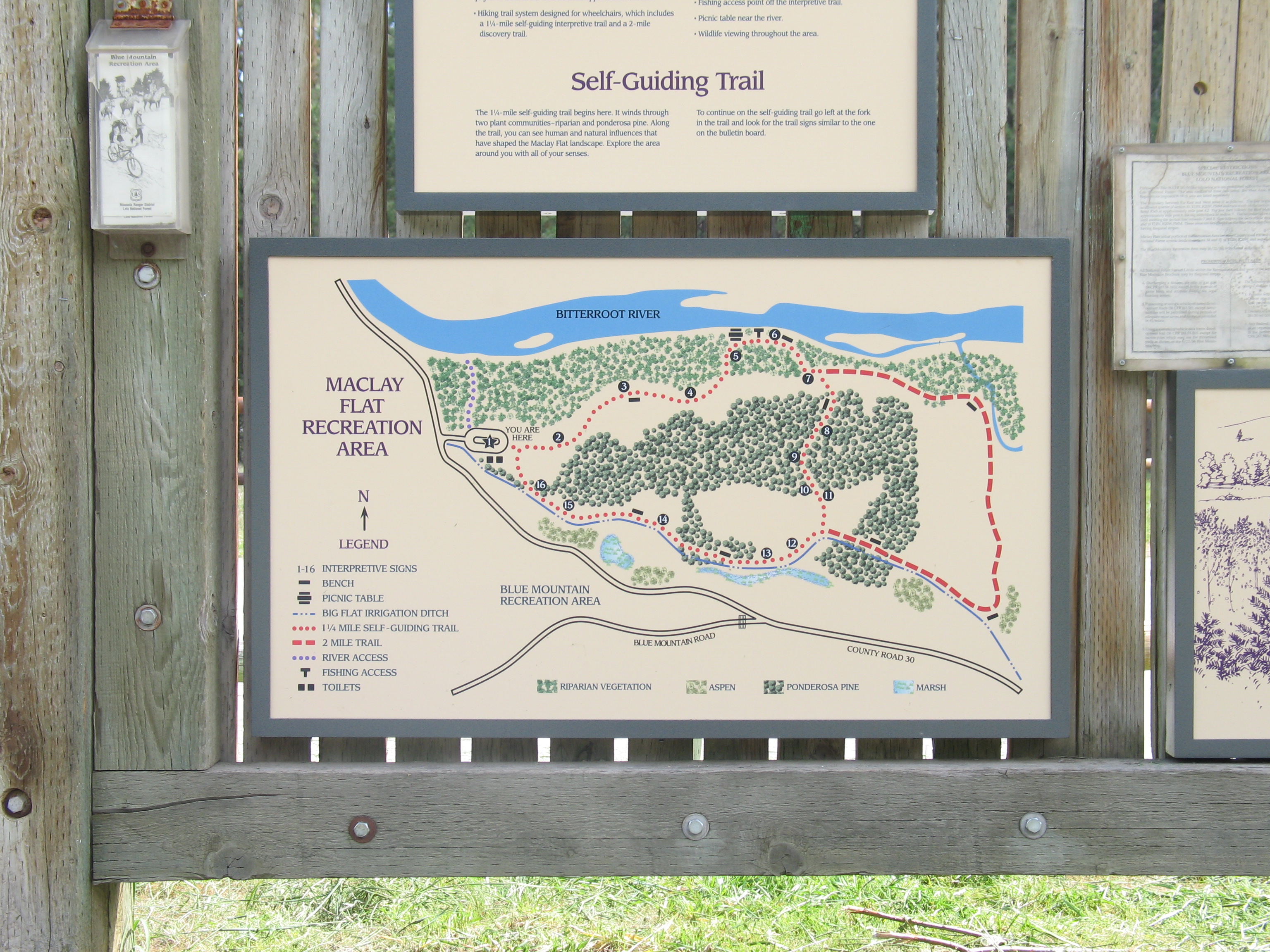 picture showing This is a photo of the map posted at the trailhead showing the 1 1/4 mile loop trail and 2-mile loop trail.